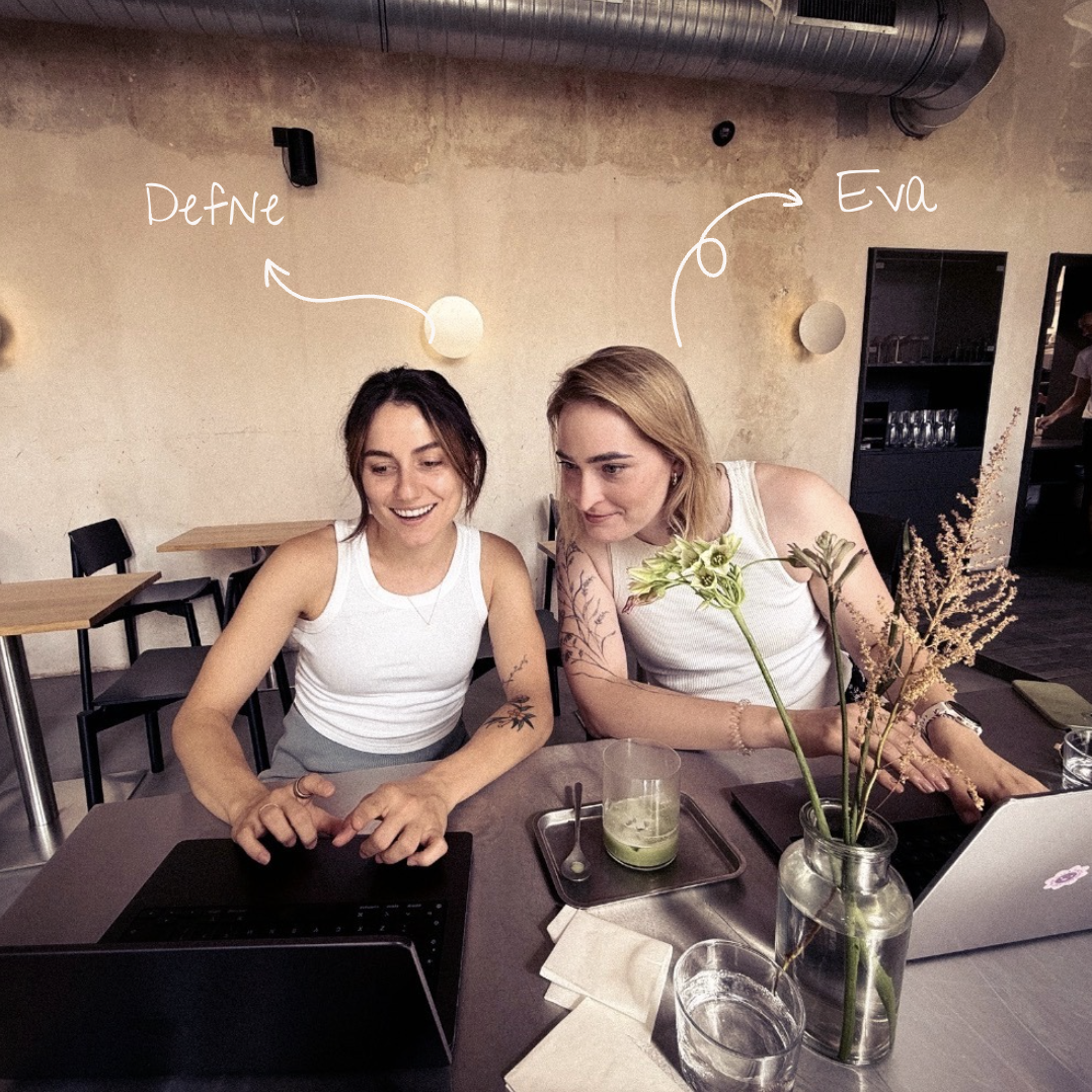 Defne and Eva building together over matcha at a Prague cafe table